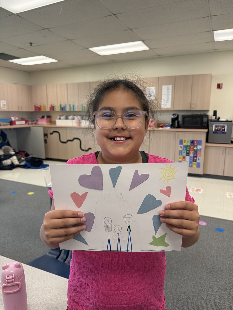 Students smiling during art