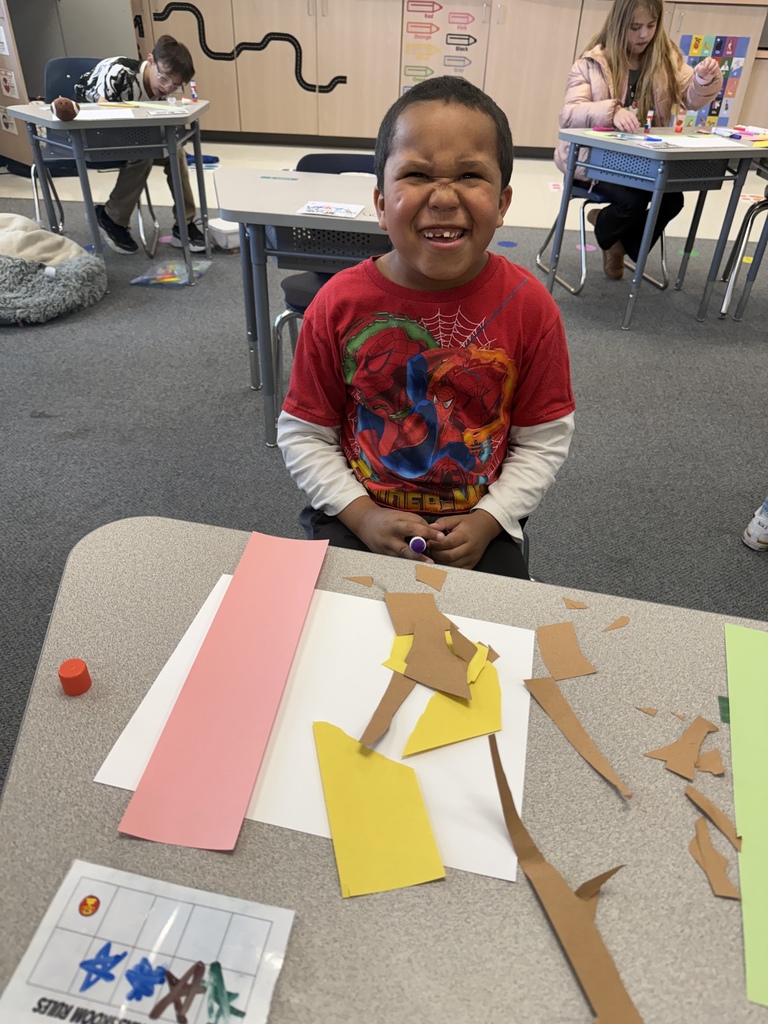 Students smiling during art
