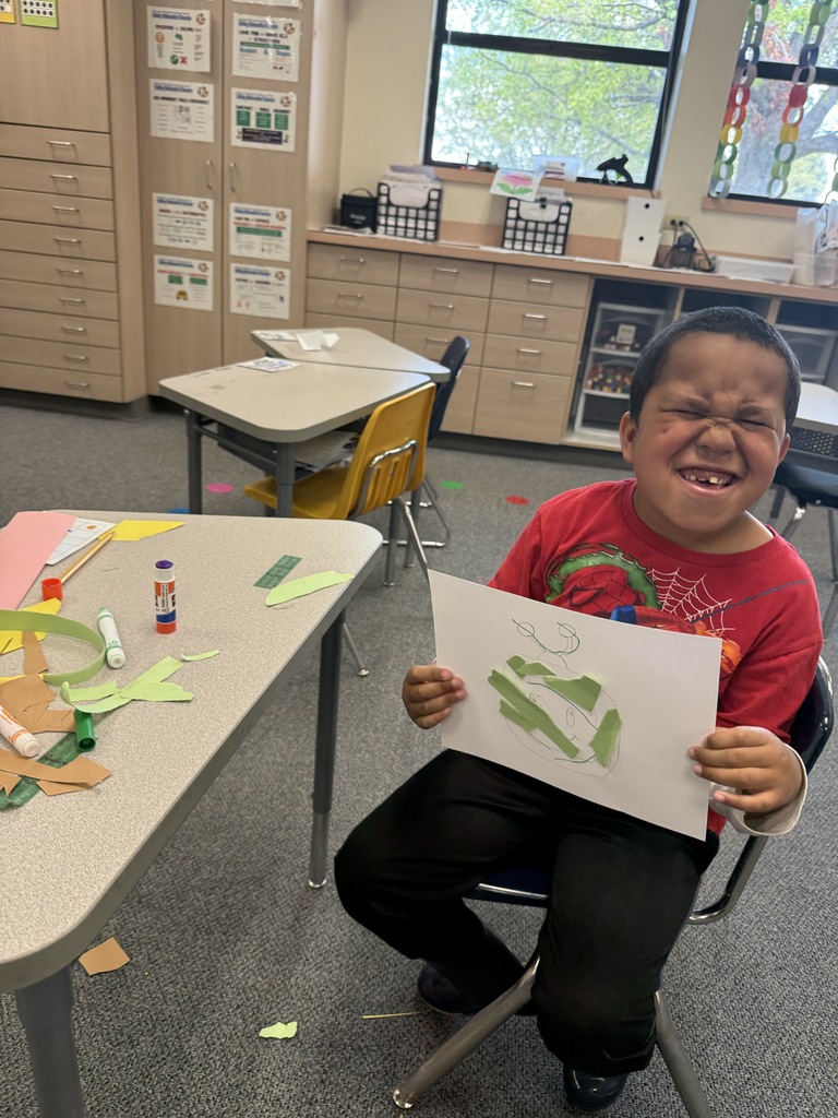 Students smiling during art