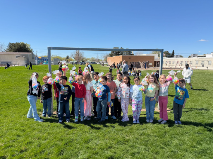 A group of students showcasing their egg haul