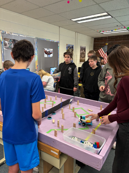 Students working together for the catapult challenge