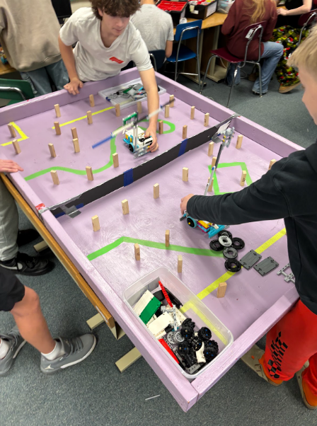 Students working together for the catapult challenge