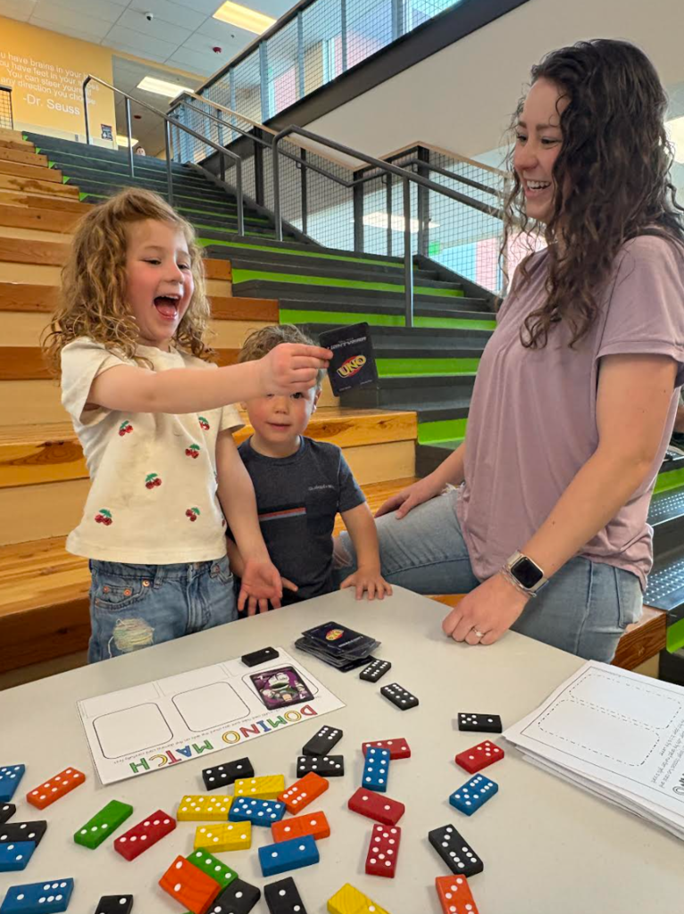 A student VERY excited for whatever uno card she drew