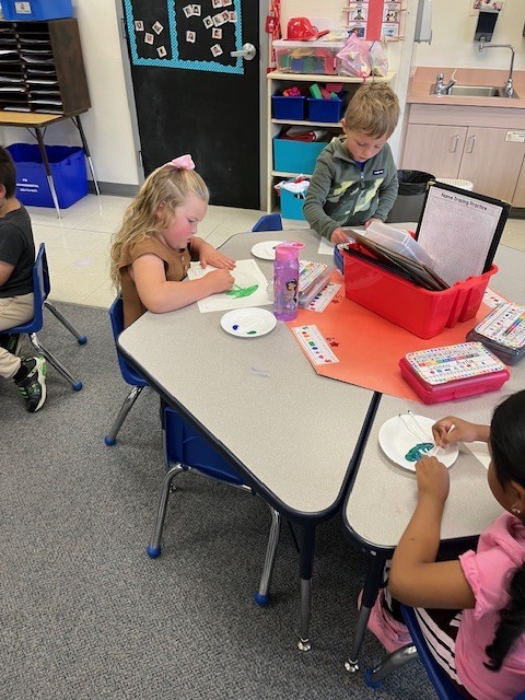students painting