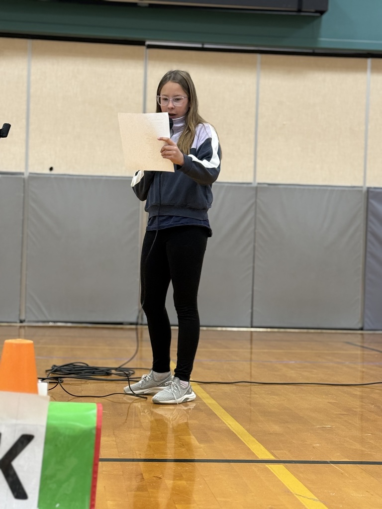 Student reading in the assembly
