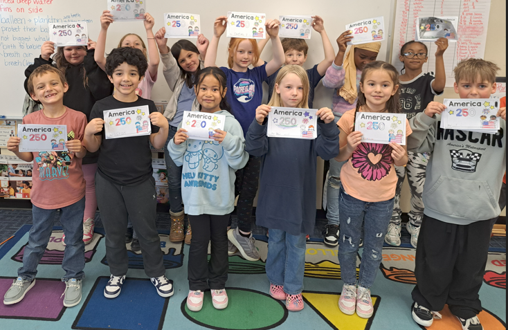Second graders show off their America 250 books