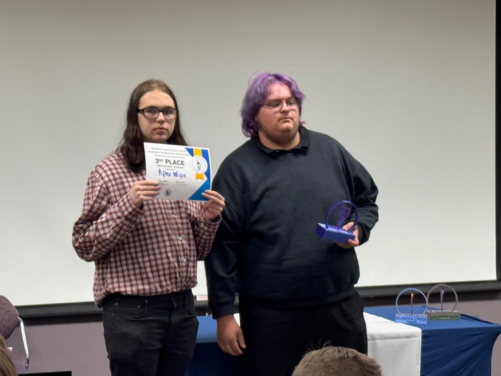 Two students pictured receiving  a "3rd Place" Trophy and certificate,