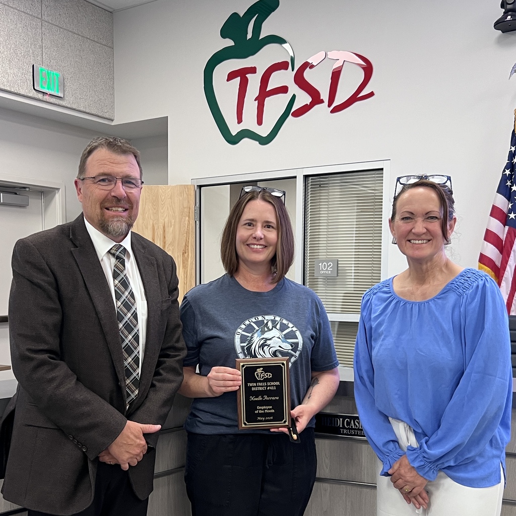 Employee of the Month pictured with superintendent and board member