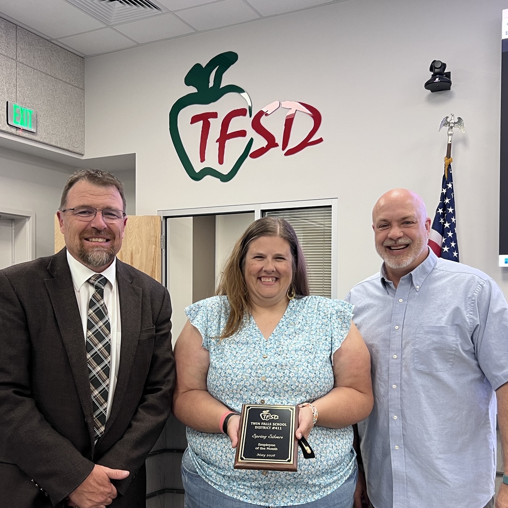 Employee of the Month pictured with superintendent and board member