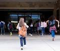 kids running into a school