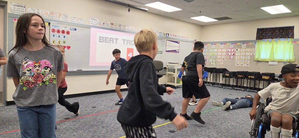 Students playing in music