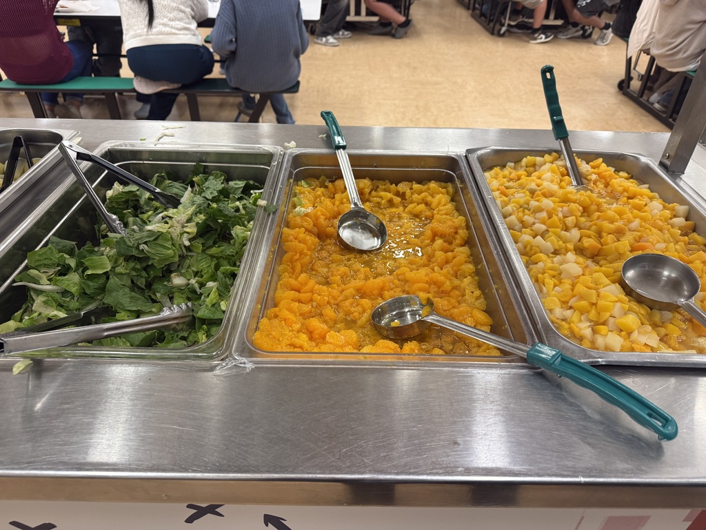 Broccoli and peaches on a food bar