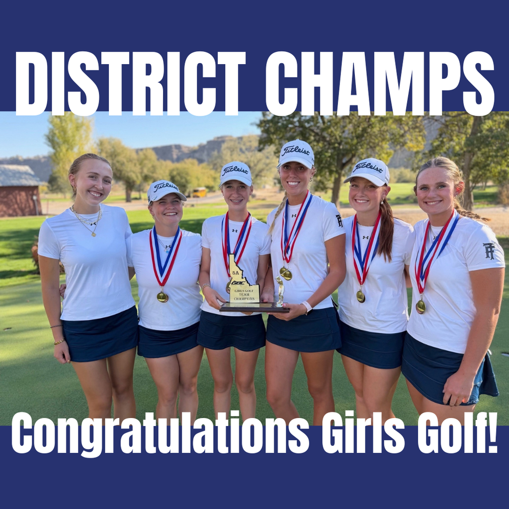 Six women in white shirts and navy skirts pose on a golf course with medals and a trophy.