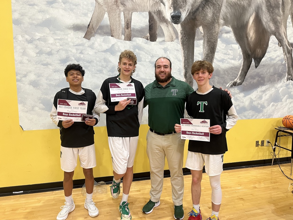 Coach Tyler with three of TPCA's basketball players. 
