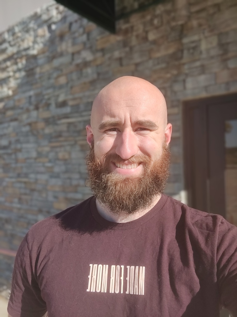 Mr. Beamis outside smiling