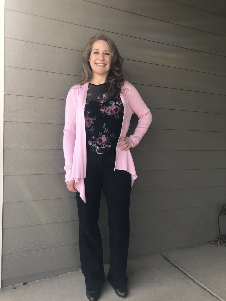 Candace Whitehouse smiling in pink cardigan outside