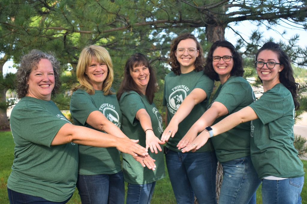 TPCA Math department holding their hands in for a group picture.