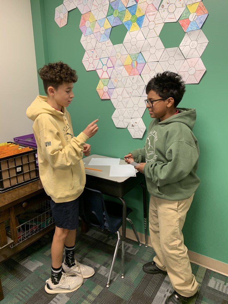 Two students quizzing each other using flashcards