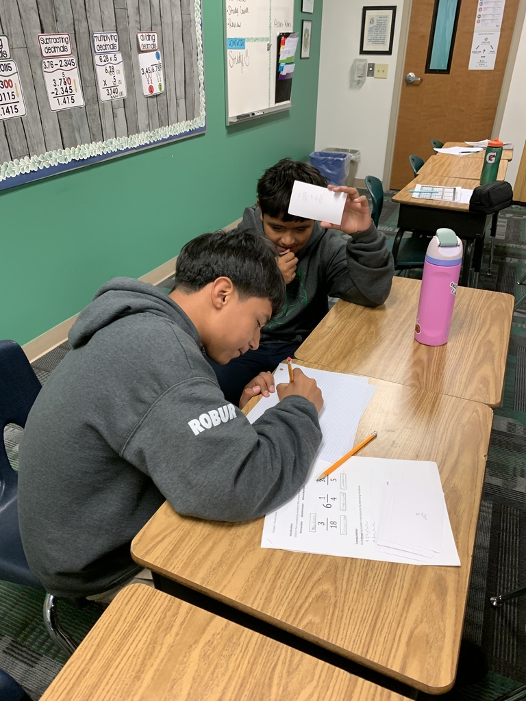 Two students working on math problems to review for the upcoming test