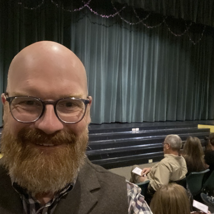 Dr. Moe selfie in front of stage