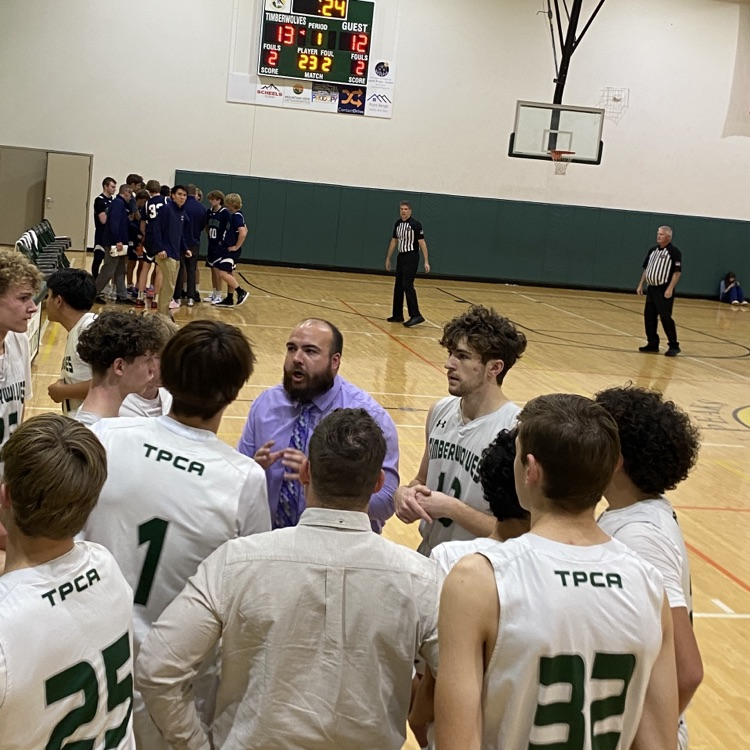 coach Tyler coaching team during time out 