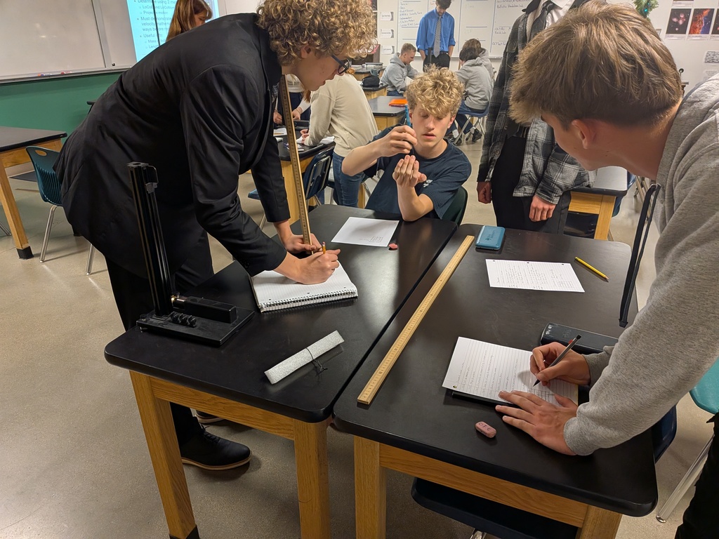 Students explaining what they observed with the pendulum