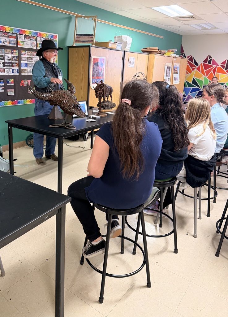 Artist sharing sculpture with students