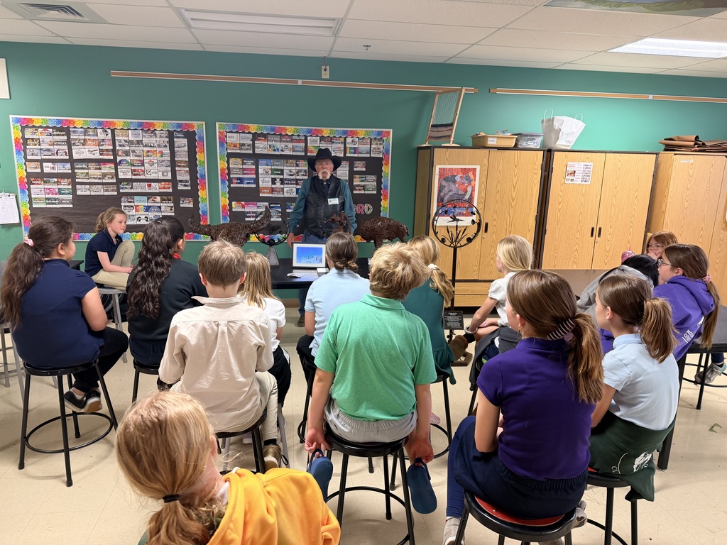 Artist sharing sculpture with students