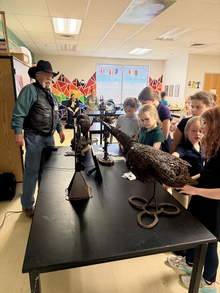 Artist sharing sculpture with students
