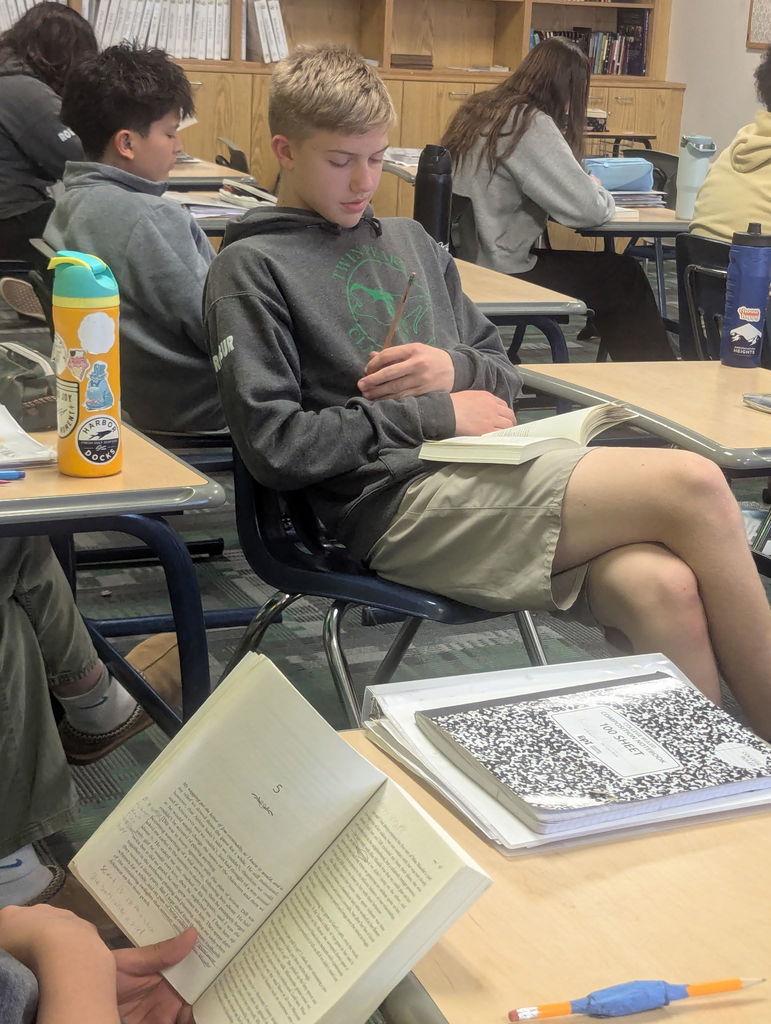 students reading books in class