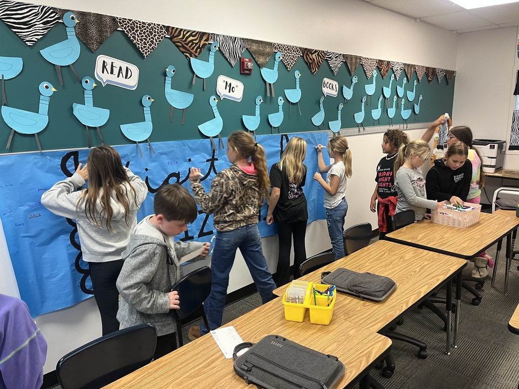 Children signing their names