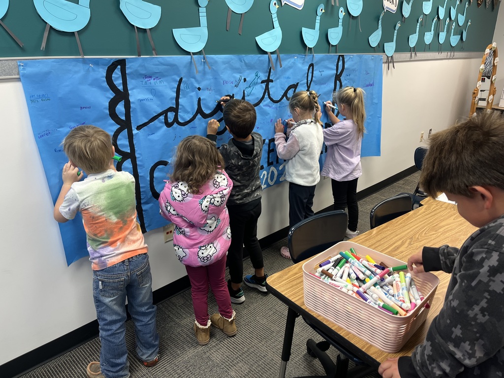 Children signing their names