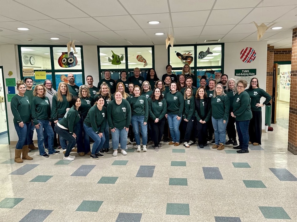 group of teacher in matching shirts