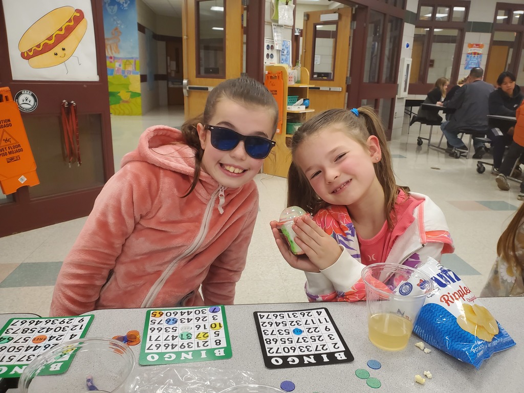 two young girls playing bingo at honey brook elementary center