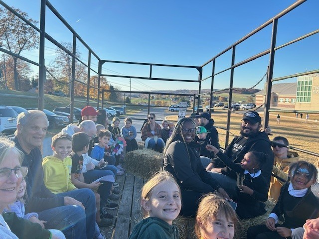Families enjoying a hayride