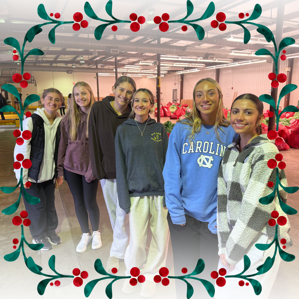 Six high school students standing in a warehouse.
