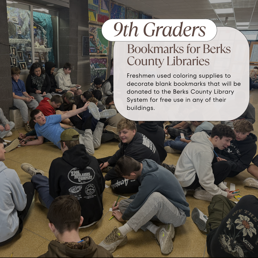 9th graders in the high school main lobby coloring in blank bookmarks to donate to local libraries