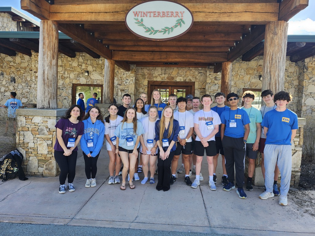 students smiling in front of winterberry resort