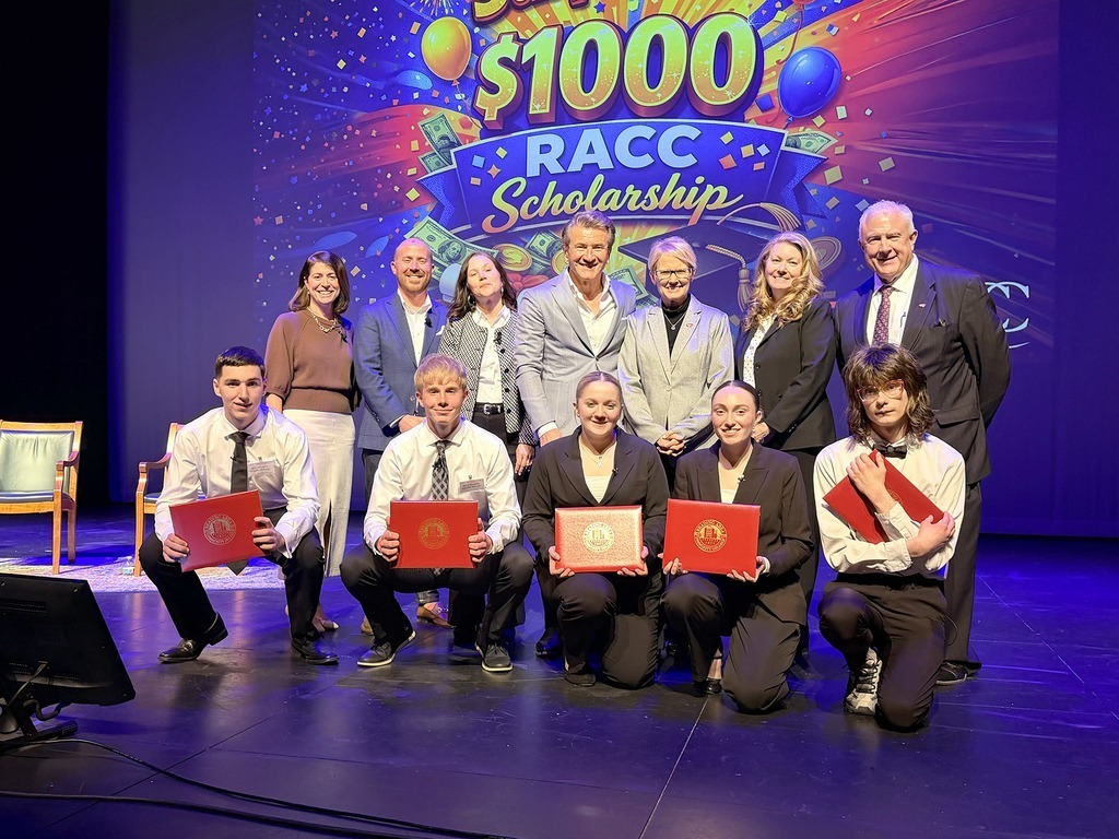 students smiling with scholarships