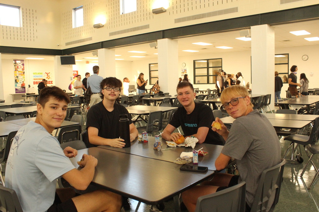 students eating breakfast at table