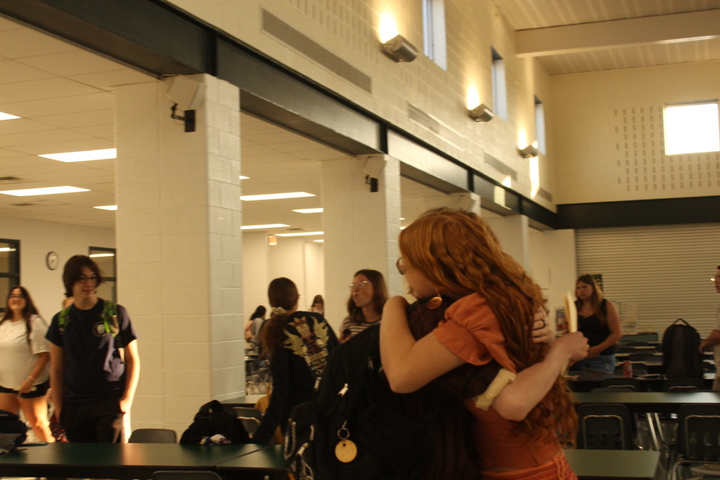 students hugging