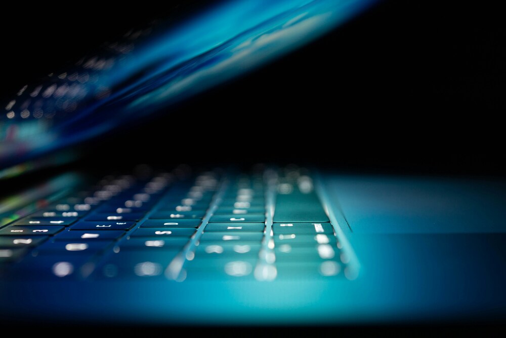 Close up image of partially opened laptop.
