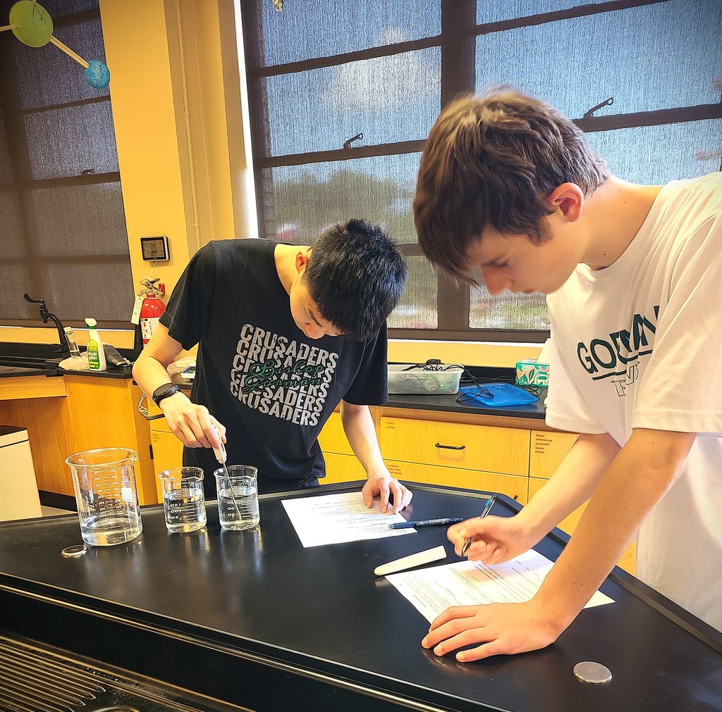 Students measuring liquids.