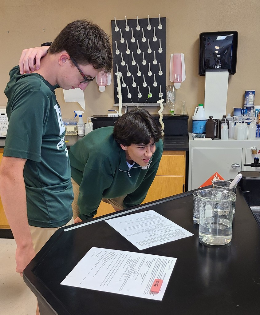 Students observing and measuring liquids