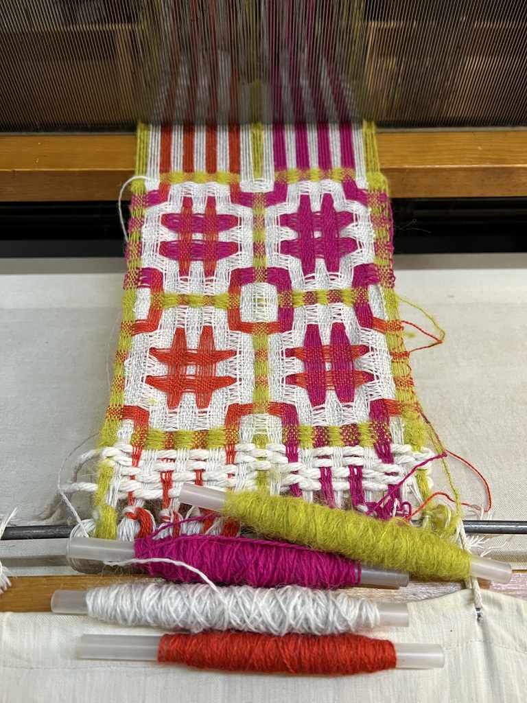 Woven art from self-dyed yarn.