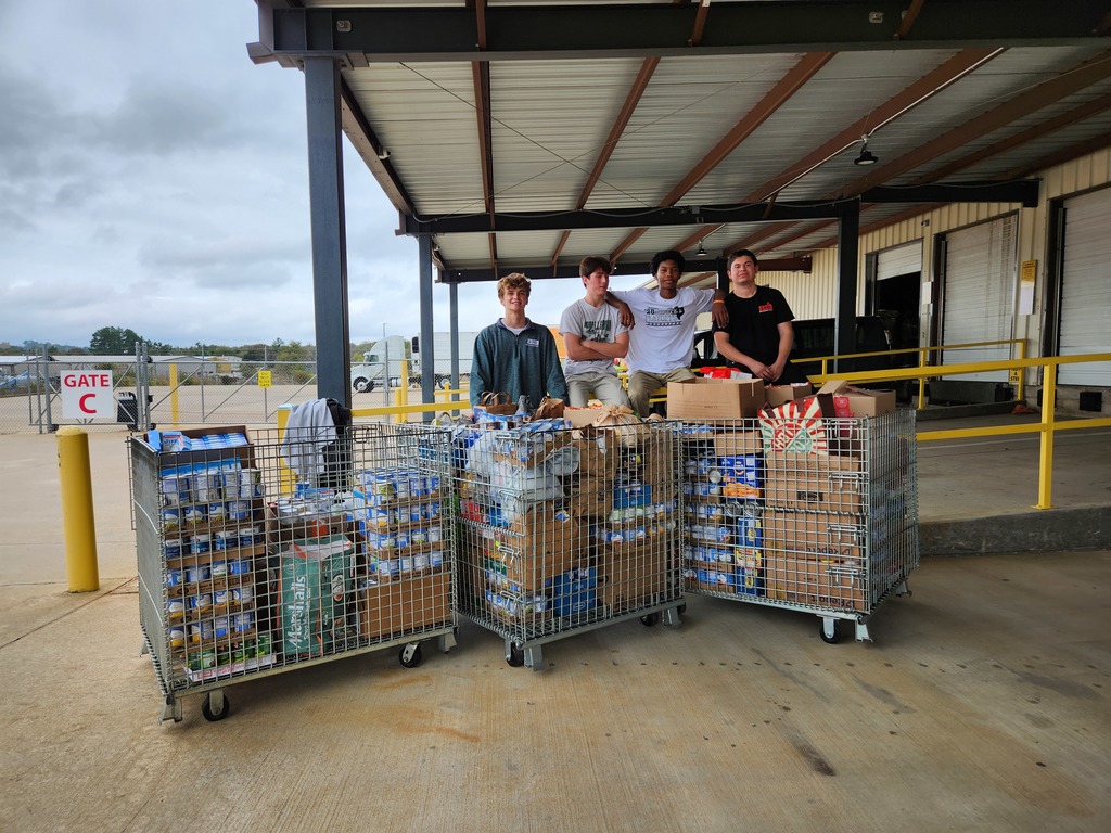 Students delivering food to the East Texas Food Bank.