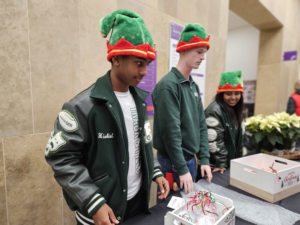 Students serving cookies