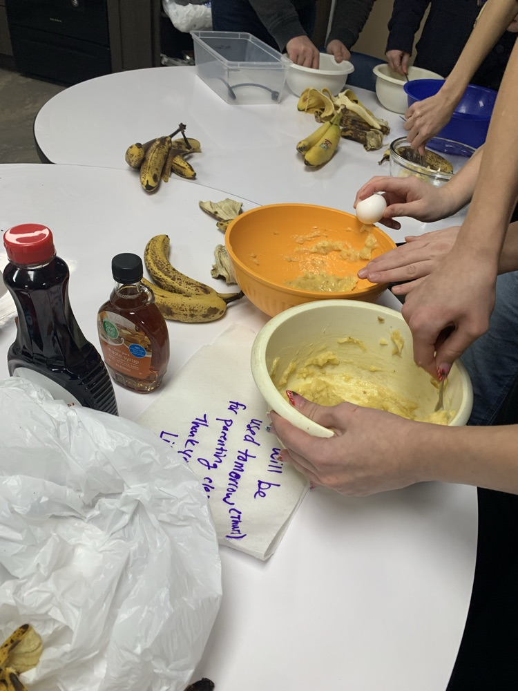 mixing banana pancakes 