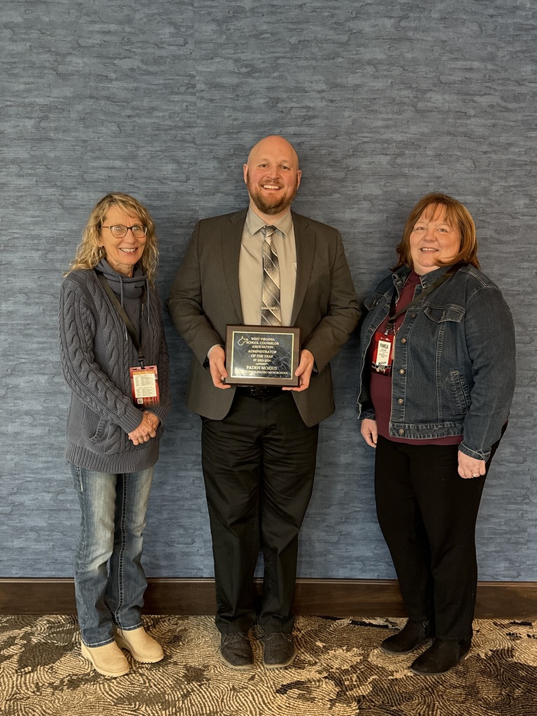 Group award photo with plaque