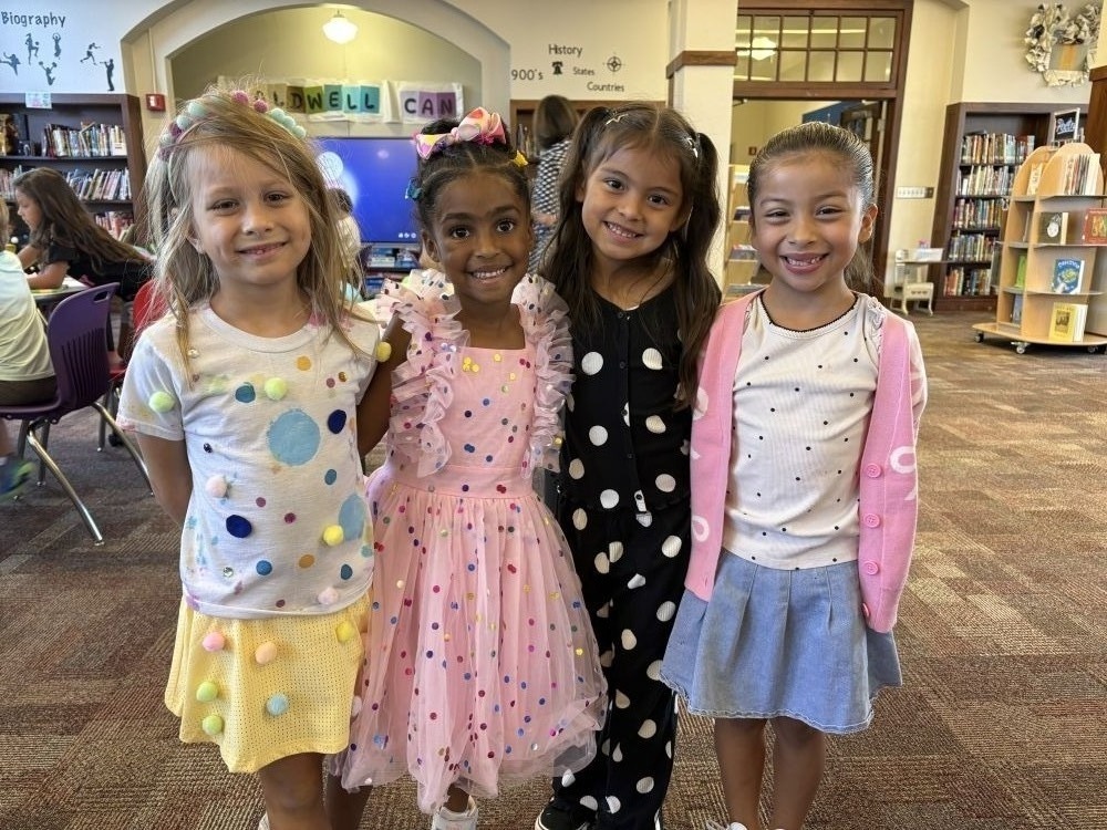 Students celebrate dot day by dressing up in dot themed outfits.
